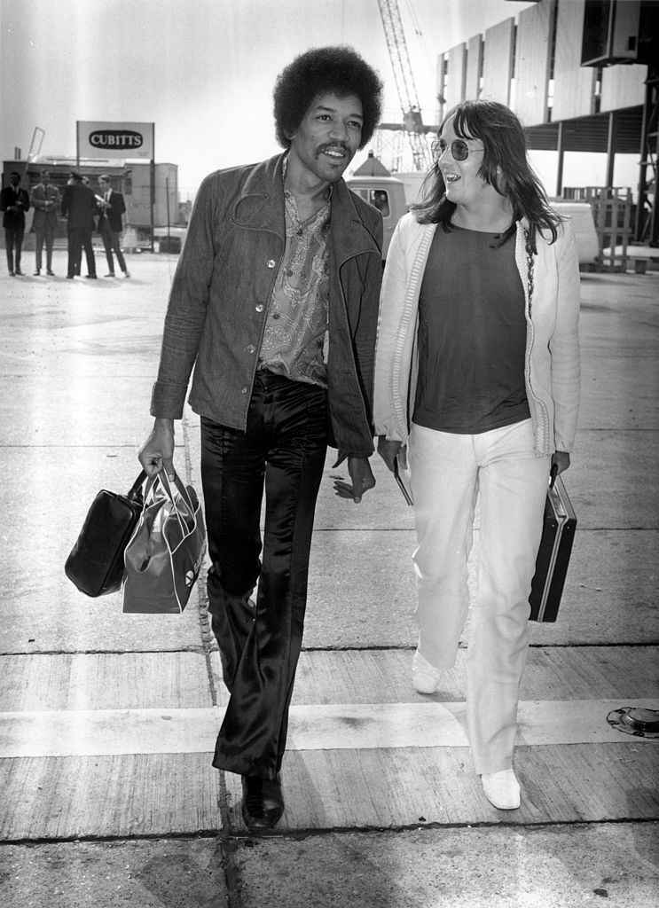 2nd September 1970:  Influential rock guitarist Jimi Hendrix (1942 - 1970) arriving at London Airport with Eric Barrett.  (Photo by Evening Standard/Getty Images)