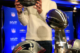 PHOENIX, AZ - FEBRUARY 02:  Tom Brady of the New England Patriots holds the Super Bowl XLIX MVP trophy during a Chevrolet Super Bowl XLIX MVP press conference following the Patriots Super Bowl win over the Seattle Seahawks on February 2, 2015 in Phoenix, Arizona.  (Photo by Jamie Squire/Getty Images)