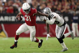 GLENDALE, AZ - AUGUST 12:  Running back David Johnson #31 of the Arizona Cardinals rushes the football past cornerback David Amerson #29 of the Oakland Raiders during the first half of the NFL game at the University of Phoenix Stadium on August 12, 2017 in Glendale, Arizona.  (Photo by Christian Petersen/Getty Images)