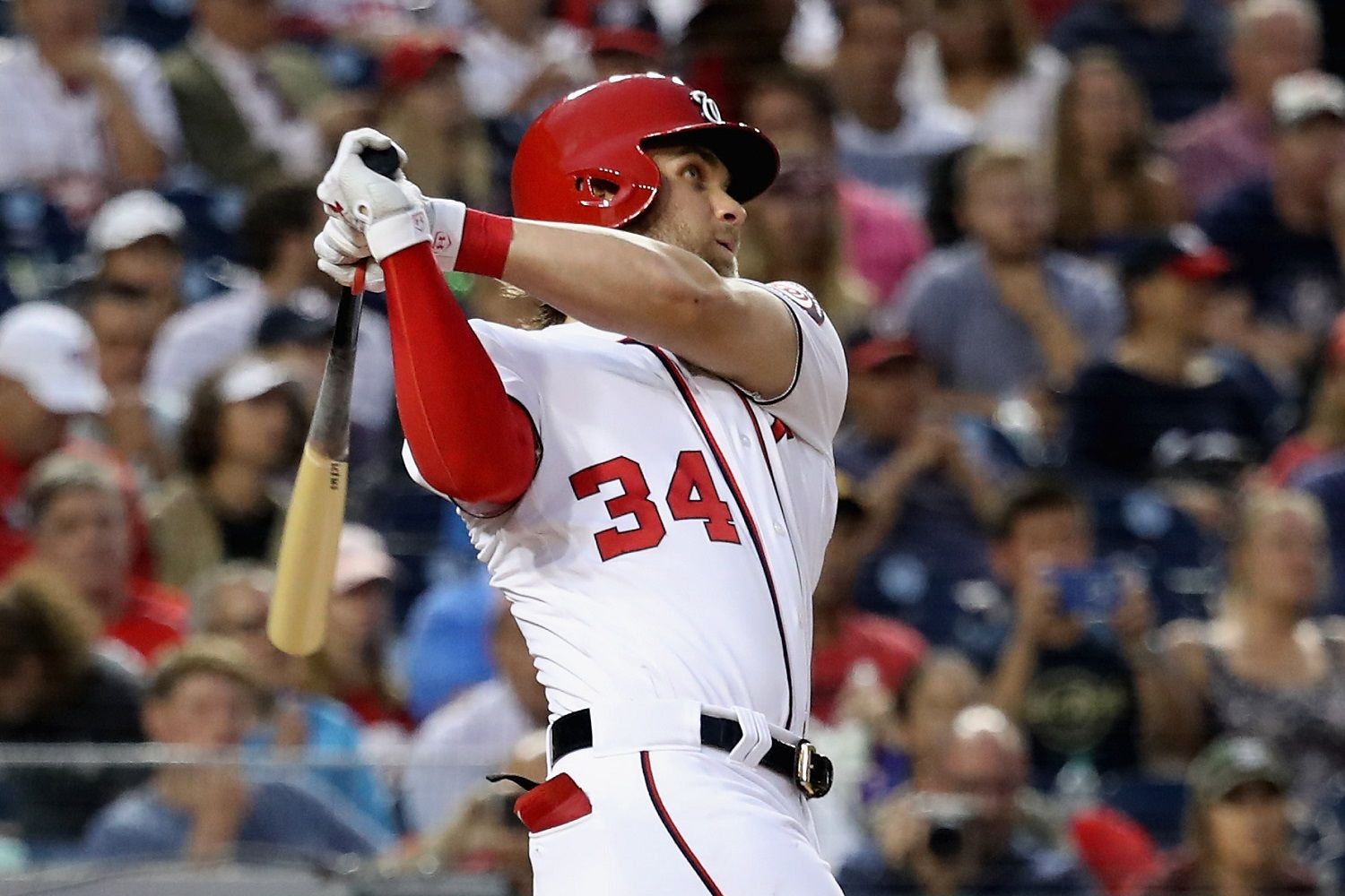 WASHINGTON, DC - AUGUST 07:  Bryce Harper #34 of the Washington Nationals follows his fourth inning solo home run against the Miami Marlins at Nationals Park on August 7, 2017 in Washington, DC.  (Photo by Rob Carr/Getty Images)