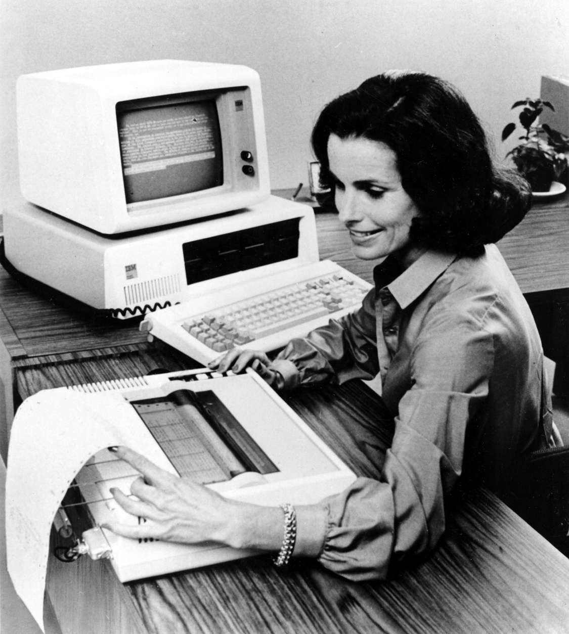 The new IBM Personal Computer system for home and school use is shown in Aug. 1981.  The expandable system includes a monitor screen, printer and disk drives.  (AP Photo)