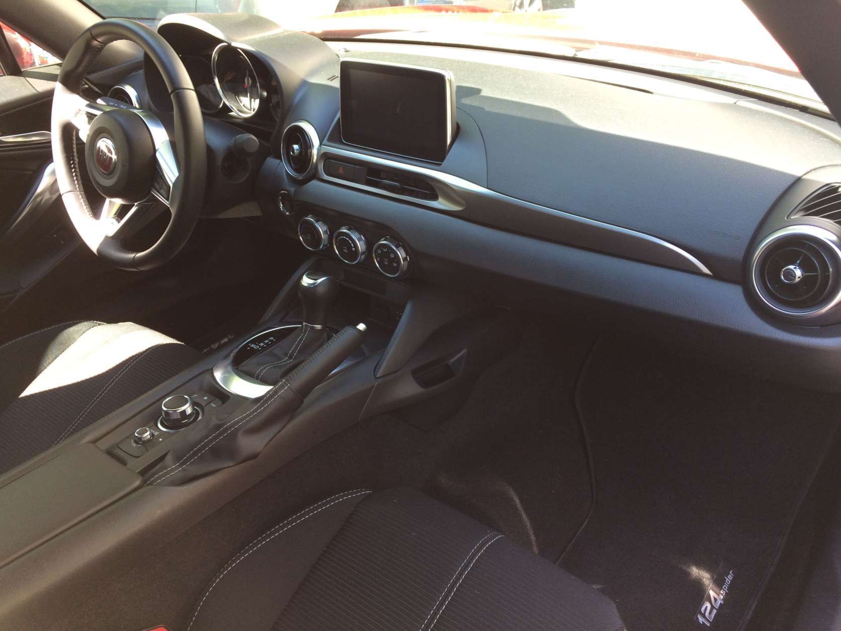 The inside of the Fiat 124 Spider seems more upscale also, with more soft- touch materials and nicer plastics. (WTOP/Mike Parris) 