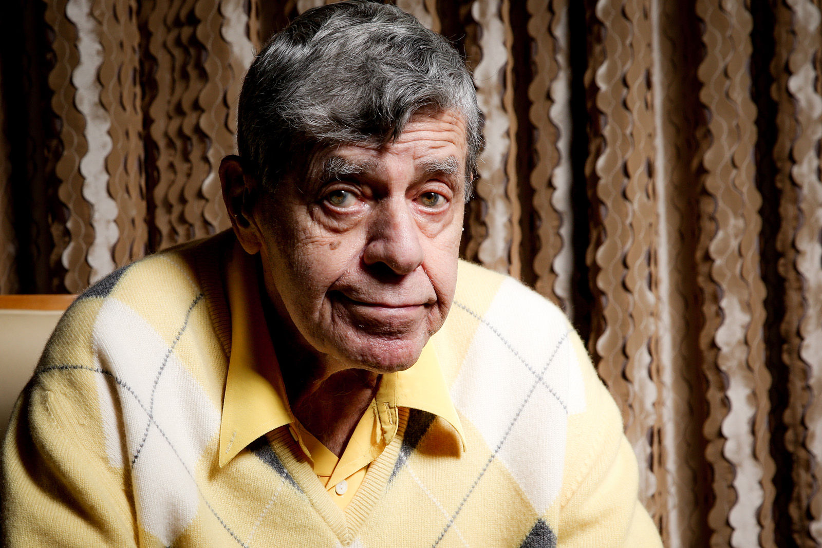 In this Aug. 24, 2016 photo, comedian Jerry Lewis reacts during an interview at the Four Seasons Hotel in Los Angeles. Getting older has been frustrating. At 90, Lewis sometimes loses his train of thought and uses a cane and a wheelchair to get around. But his desire to connect with audiences, and with people, is undiminished. (Photo by Rich Fury/Invision/AP)