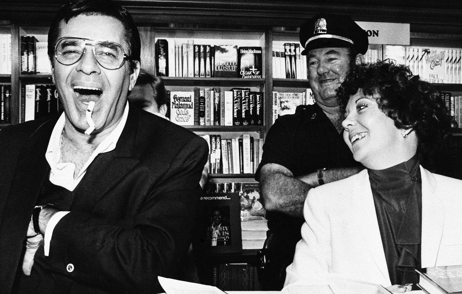 Comedian Jerry Lewis, left, with his fianc?e Sandee Pitnick, clowns around Saturday during an autograph session on Saturday, Oct. 10, 1982 at a Cambridge, Mass., bookstore where he was promotong his new book, "Jerry Lewis in Person."   (AP Photo/Keith Jacobson)