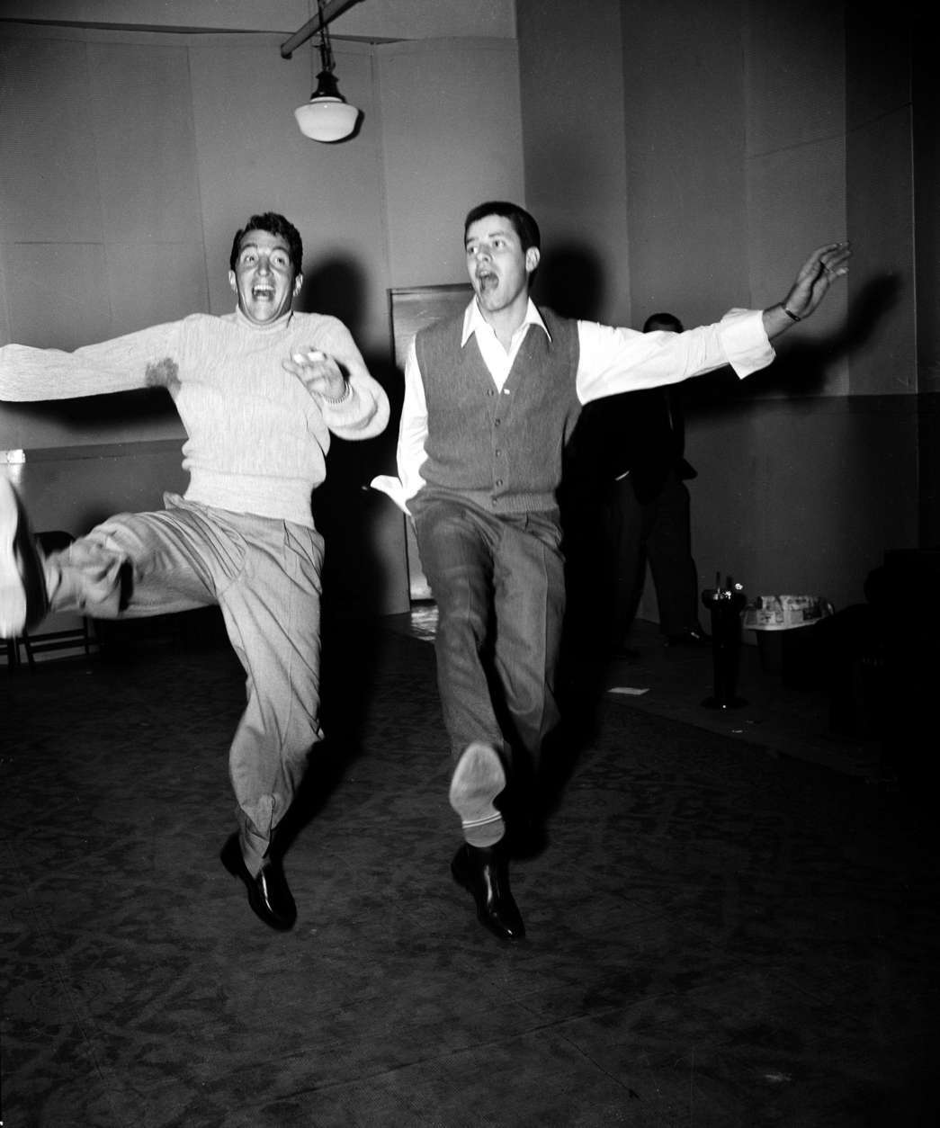 Comedy duo Dean Martin, left, and Jerry Lewis rehearse at the Nola Studios in New York City for their opening at the Copacabana, Jan. 20, 1954.  (AP Photo/Dan Grossi)