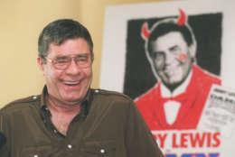 Entertainer Jerry Lewis laughs as he fields questions from the media at the  Ritz-Carlton Hotel in Pasadena, Calif., Tuesday, Nov. 28, 1995. Lewis is starring in the nationally touring production of the Broadway musical "Damn Yankees," which comes to the Pasadena Civic Auditorium for eight performances starting Nov. 28. (AP Photo/Chris Pizzello)