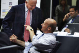 Washington Nationals owner Mark Lerner, left, shakes hands with the baseball team's president, Stan Kasten, right, after the Nationals selected pitcher Stephen Strasburg with the first pick in the baseball draft, at Nationals Park in Washington, Tuesday, June 9, 2009. (AP Photo/Manuel Balce Ceneta)
