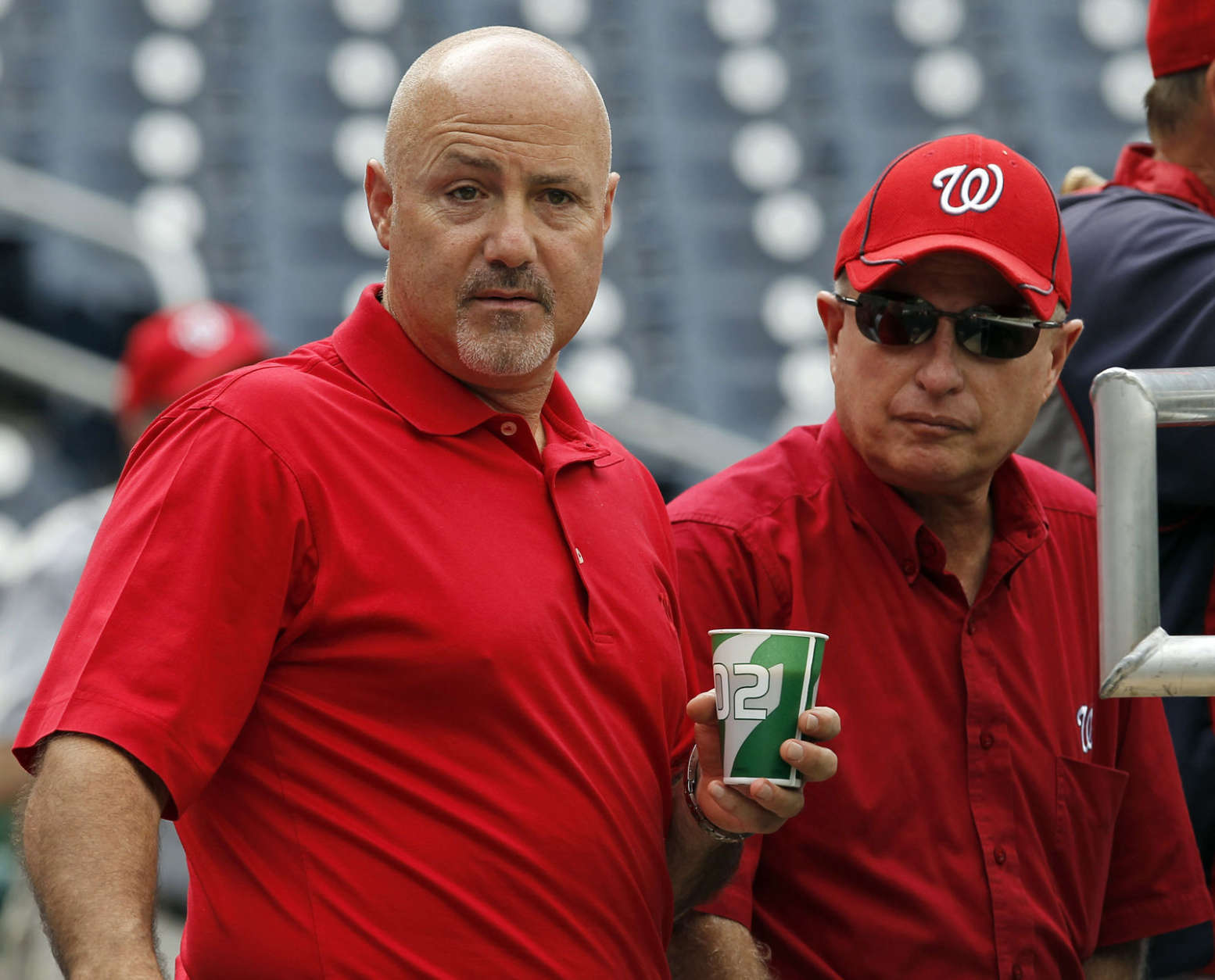 Washington Nationals general manager Mike Rizzo, left, stands with owner Mark Lerner before a baseball game with the Atlanta Braves at Nationals Park on Monday, Aug. 20, 2012, in Washington. (AP Photo/Alex Brandon)