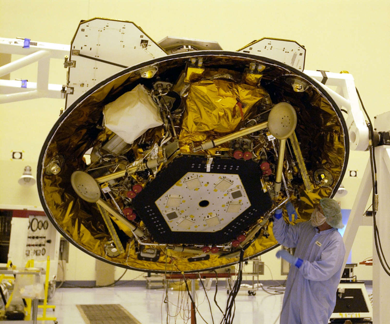 A technician makes checks on NASA's Phoenix Mars Lander in the Payload Hazardous Servicing Facility at the Kennedy Space Center in Cape Canaveral, Fla. Tuesday, June 26, 2007. The Phoenix spacecraft is scheduled for launch on a Delta II rocket Aug. 3. It will land in the arctic region of Mars. (AP Photo/Peter Cosgrove)