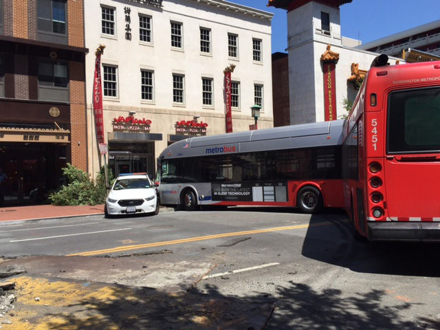 Scene of a bus crash into a building on the 600 block of H Street NW. (WTOP/James Hoeflinger)
