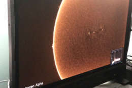 The photos are from NASA's Lunt Portable lab where they take in the sun with 4-6k cameras in real time to create different images of the sun. (WTOP/Steve Dresner)