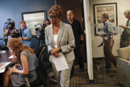 Barbara Butler, followed by her husband Phillip Butler, arrive for a news conference at their attorney's office in Washington, Wednesday, Aug. 23, 2017. The Butlers, victims of a cross burning on their property forty years ago, is questioning the sincerity of Catholic Priest William Aitcheson, a Ku Klux Klan "wizard", who has come forward after decades about his past. (AP Photo/Pablo Martinez Monsivais)