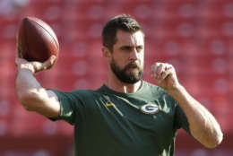 Green Bay Packers quarterback Aaron Rodgers (12) warms up before an NFL pre-season football game against the Washington Redskins in Landover, Md., Saturday, Aug. 19, 2017. (AP Photo/Mark Tenally)