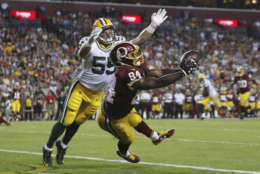 Washington Redskins tight end Niles Paul (84) pulls in a touchdown pass under pressure from Green Bay Packers linebacker Cody Heiman (55) during the second half of an NFL preseason football game in Landover, Md., Saturday, Aug. 19, 2017. (AP Photo/Alex Brandon)