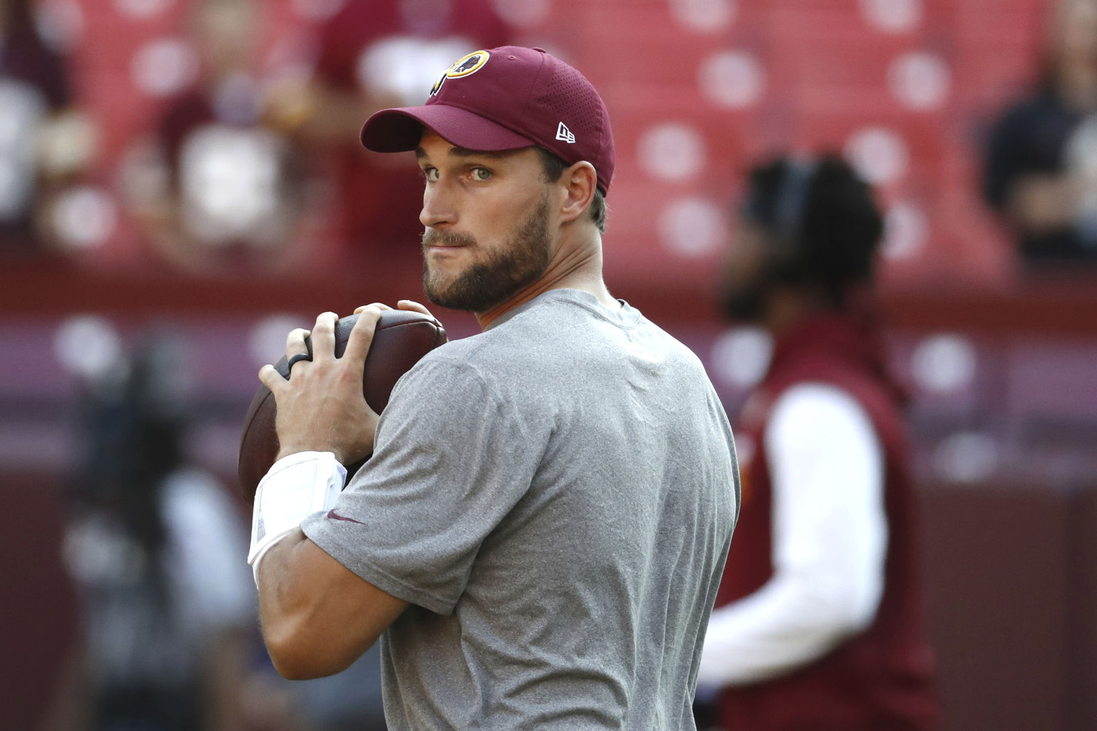 Washington Redskins quarterback Kirk Cousins (8) warms up before an NFL pre-season football game against the Green Bay Packers in Landover, Md., Saturday, Aug. 19, 2017. (AP Photo/Alex Brandon)