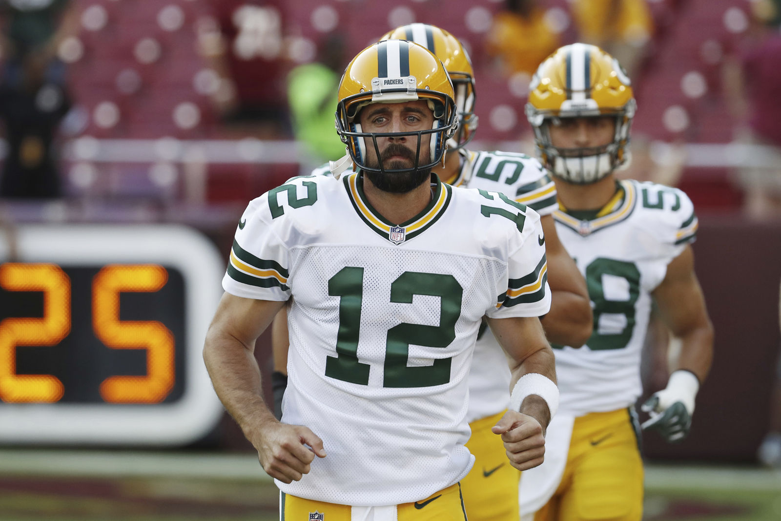 Green Bay Packers quarterback Aaron Rodgers (12) runs out onto the field before an NFL preseason football game against the Washington Redskins in Landover, Md., Saturday, Aug. 19, 2017. (AP Photo/Alex Brandon)