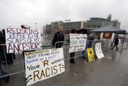 The ban on Redskins gear at Green Acres School came after a classroom discussions about team logos that are based on race or ethnicity. In this photo, people protest the Redskins name outside Lambeau Field before an NFL football game between the Green Bay Packers and the Washington Redskins Sunday, Sept. 15, 2013, in Green Bay, Wis. (AP Photo/Tom Lynn)