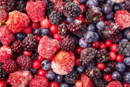 Close up of frozen mixed fruit - berries - red currant, raspberry, strawberry, blackberry, blueberry