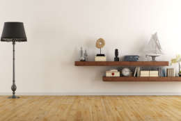 Retro vintage living room with  wooden shelves with books and decor objects - 3D Rendering