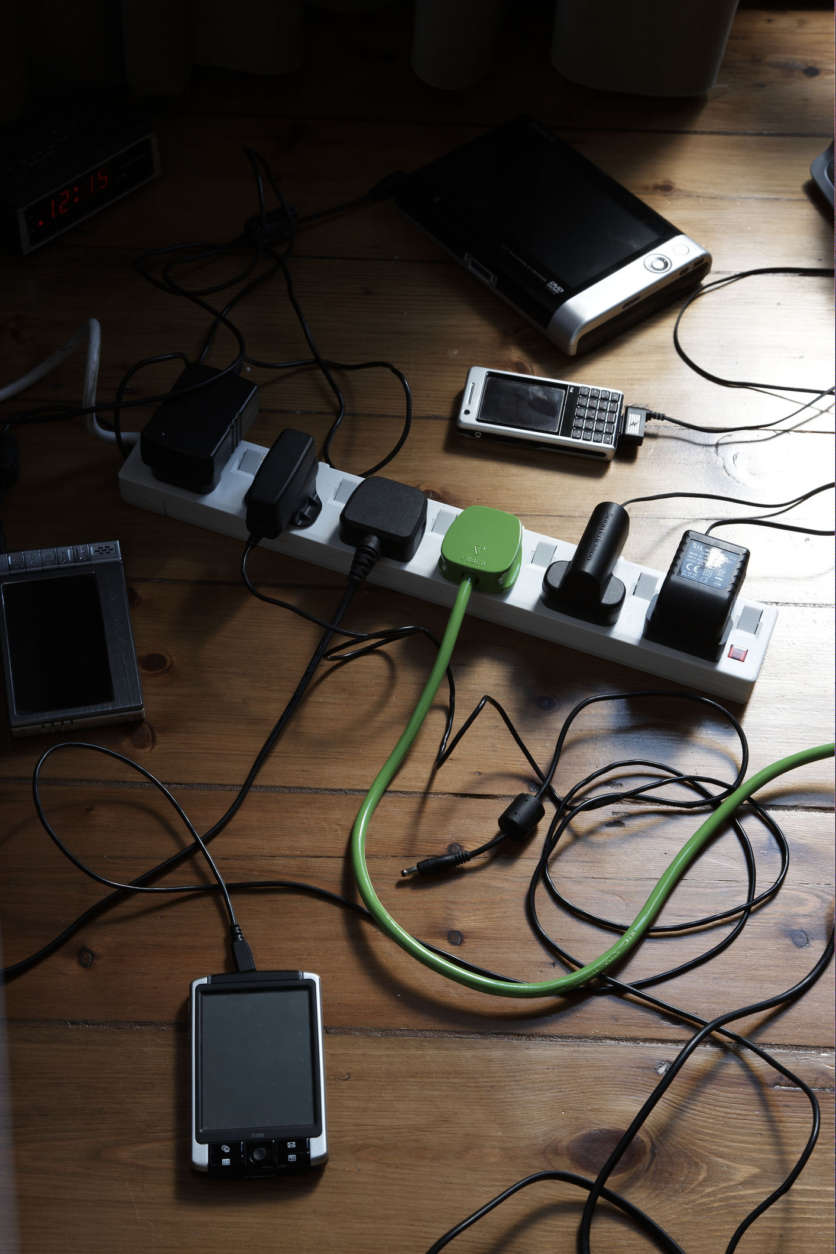 different power cables on floor one green