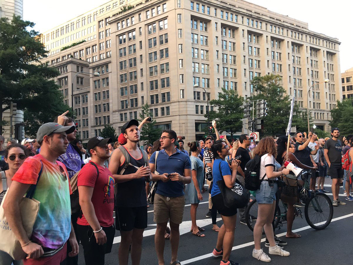 Protesters in front of the Trump Hotel during their march against hatred and bigotry in D.C. on August 13. Many people claim that Trump's condemnations of the violence in Charlottesville, Virginia did not do enough to condemn white supremacists. (WTOP/Liz Anderson)