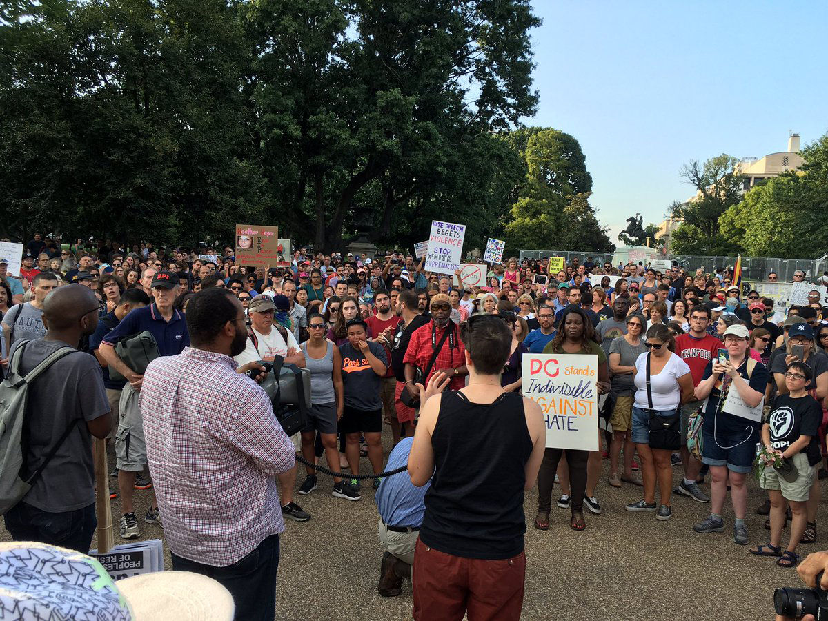 In the wake of the violence in Charlottesville, Virginia on August 12, a group gathered in front of the White House to denounce hate and bigotry. (WTOP/Liz Anderson)