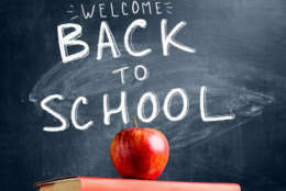 Back to School. Books and fresh apple against chalkboard (Thinkstock)