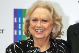 FILE - In this Dec. 7, 2013 file photo, Barbara Cook arrives at the State Department for the Kennedy Center Honors gala dinner in Washington. Cooks return to a New York stage in a show about her life has been postponed. Producers said Monday, March 28, 2016, that "Barbara Cook: Then and Now," conceived by James Lapine and directed by Tommy Tune, will not be staged this spring at the New World Stages complex. (AP Photo/Kevin Wolf, File)
