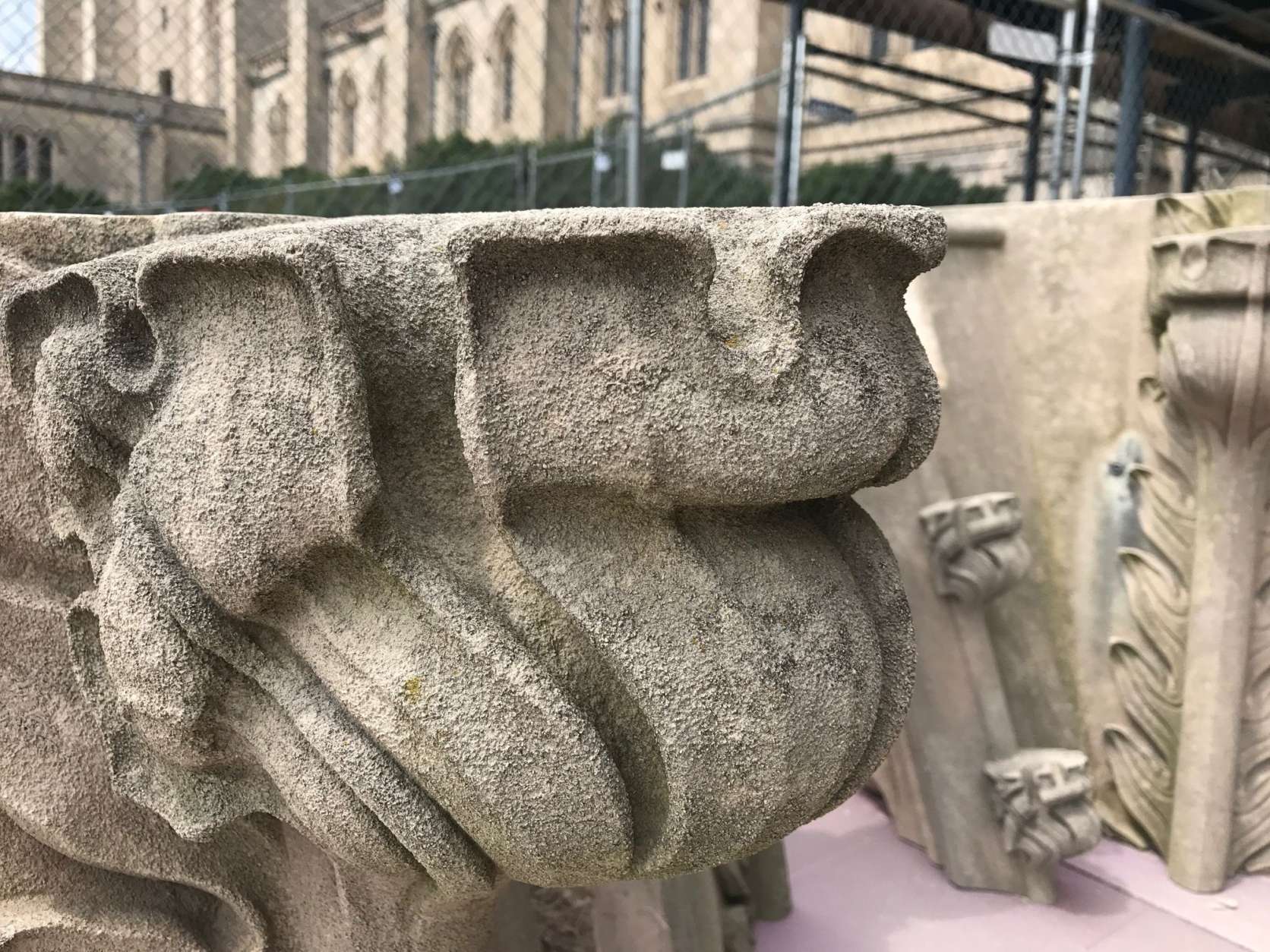 The stone twisted during the earthquake damaging many corners of the stone carvings, said National Cathedral stone carver Sean Callahan. (WTOP/Megan Cloherty)