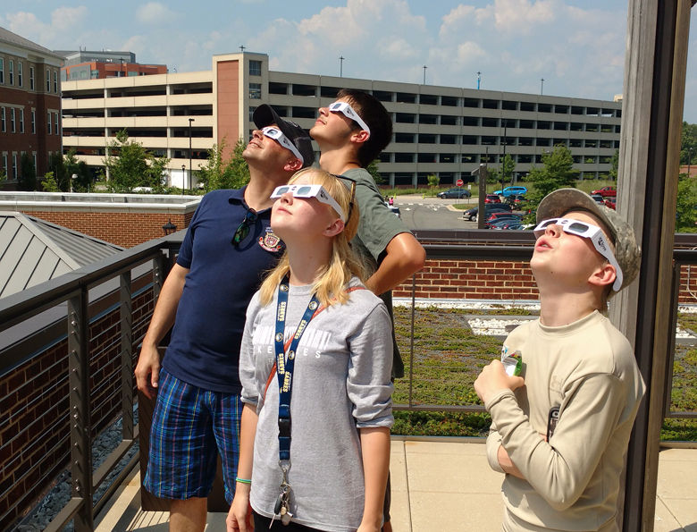 The Wolin family watches the eclipse from Fort Belvoir. (Courtesy WTOP listener)