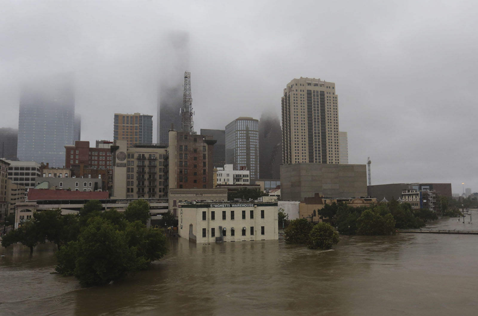 Floodwaters from Tropical Storm Harvey flow in the Buffalo Bayou in downtown Houston, Texas, Monday, Aug. 28, 2017. (AP Photo/LM Otero)