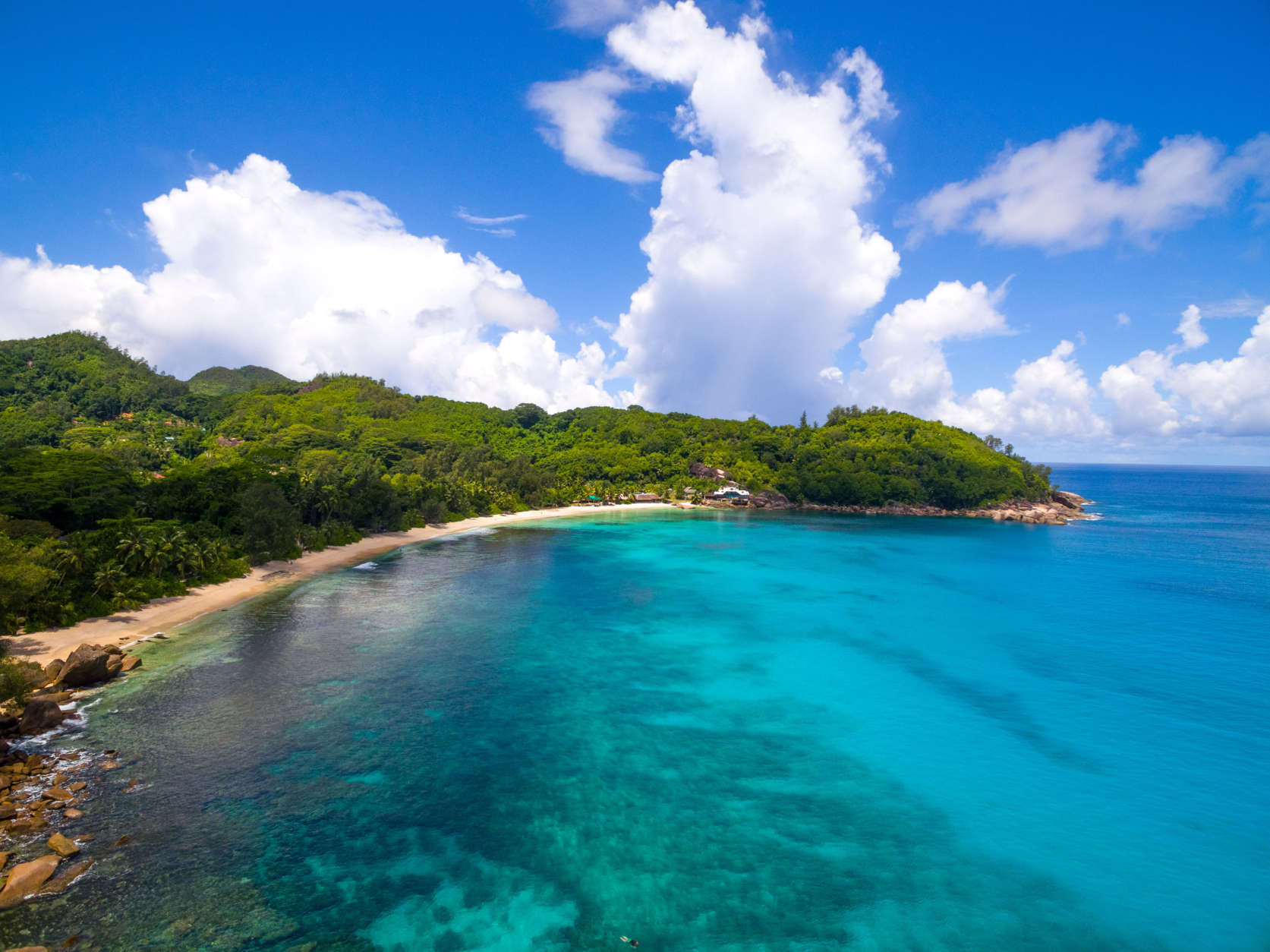 Aerial shot of beautiful coastline and beaches of tropical Mahé Island, Seychelles.
