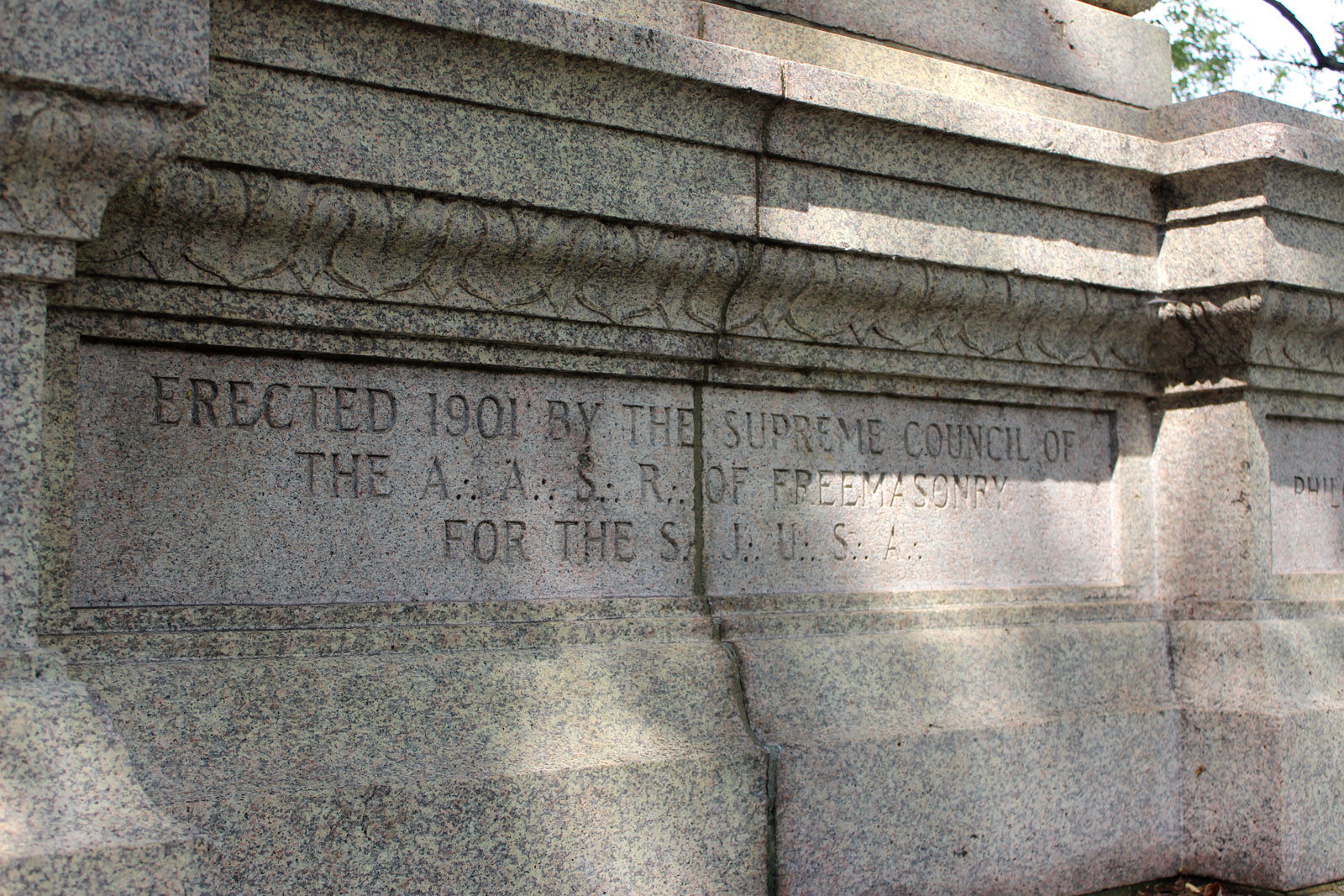The inscription reads: Erected 1901 by the Supreme Council of the A.A. S.R. of Freemasonry for the S.J.U.S.A. (WTOP/Amanda Iacone)