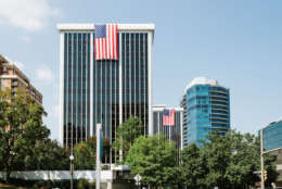 The tradition of draping huge American flags from the tops of Rosslyn office buildings is now in its 16th year. (Courtesy Rosslyn Business Improvement District).