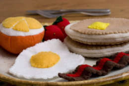 **FOR USE WITH AP LIFESTYLES**   A plate of felt breakfast including eggs, fruit, pancakes and bacon is seen Wednesday, Feb. 27, 2008, in Concord, N.H.    Plush food also is gaining ground among crafty moms in search of lead-free toys for their tots.      (AP Photo/Larry Crowe)
