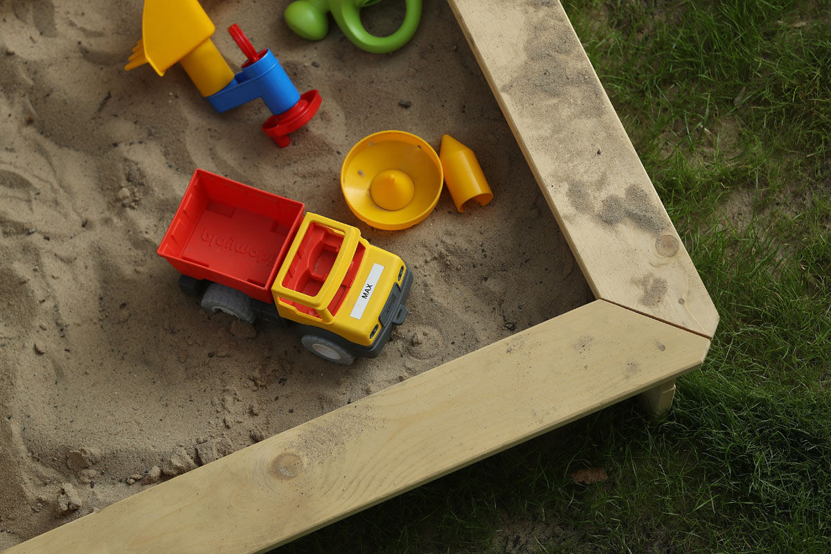 BERLIN, GERMANY - AUGUST 31:  A sandbox with a child's toys lies in a garden on August 31, 2017 in Berlin, Germany. With approximately three weeks to go before federal elections in Germany political parties are debating Germany's child benefits policy. Known in German as "Kindergeld," parents receive monthly money from the state for each child as a form of subsidy to encourage families to have children. Germany suffered from a falling birthrate for decades, a phenomenon that has reversed in recent years.  (Photo by Sean Gallup/Getty Images)