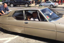 Comedians Dave Chappelle and Jerry Seinfeld sitting inside the gold Citroen coupe they were filming in. The crew ran into a glitch: The car woudn't start. (WTOP/Kristi King)