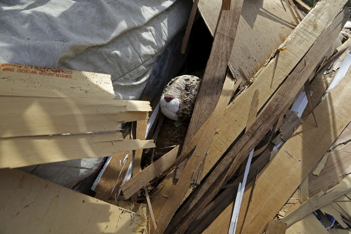 A stuffed animal its seen in the ruins of the home of Jose Garcia Vicente, in the aftermath of Hurricane Maria, in Aibonito, Puerto Rico, Monday, Sept. 25, 2017. The U.S. ramped up its response Monday to the humanitarian crisis in Puerto Rico while the Trump administration sought to blunt criticism that its response to Hurricane Maria has fallen short of it efforts in Texas and Florida after the recent hurricanes there. (AP Photo/Gerald Herbert)