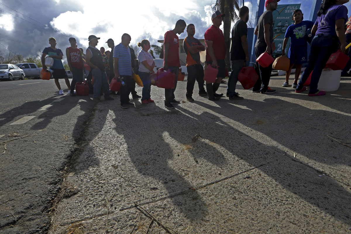 People wait in line for gas, in the aftermath of Hurricane Maria, in Aibonito, Puerto Rico, Monday, Sept. 25, 2017. The U.S. ramped up its response Monday to the humanitarian crisis in Puerto Rico while the Trump administration sought to blunt criticism that its response to Hurricane Maria has fallen short of it efforts in Texas and Florida after the recent hurricanes there. (AP Photo/Gerald Herbert)