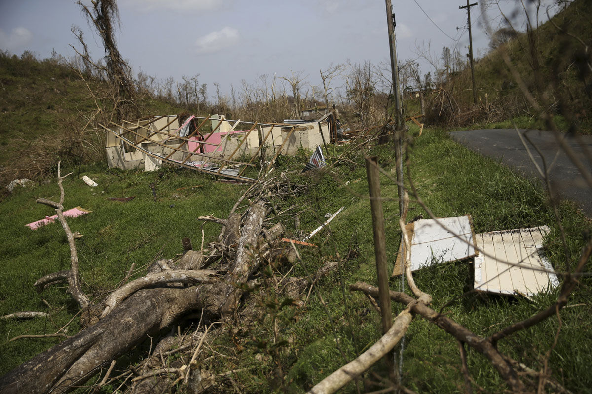 A scene of destruction, which is typical of damage across much of Puerto Rico, in Montebello, Puerto Rico, in the aftermath of Hurricane Maria, Tuesday, Sept. 26, 2017. (AP Photo/Gerald Herbert)