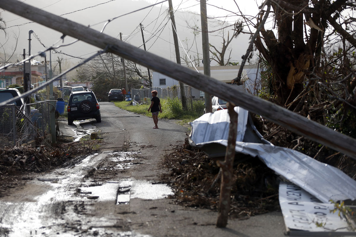 Downed paper lines and debris are seen in the aftermath of Hurricane Maria in Yabucoa, Puerto Rico, Tuesday, Sept. 26, 2017. (AP Photo/Gerald Herbert)