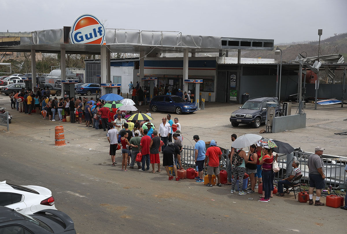 COROZAL, PUERTO RICO - SEPTEMBER 27:  People wait in line for gas as they deal with the aftermath of Hurricane Maria on September 27, 2017 in Corozal, Puerto Rico.  Puerto Rico experienced widespread, severe damage including most of the electrical, gas and water grids as well as agricultural destruction after Hurricane Maria, a category 4 hurricane, passed through.  (Photo by Joe Raedle/Getty Images)