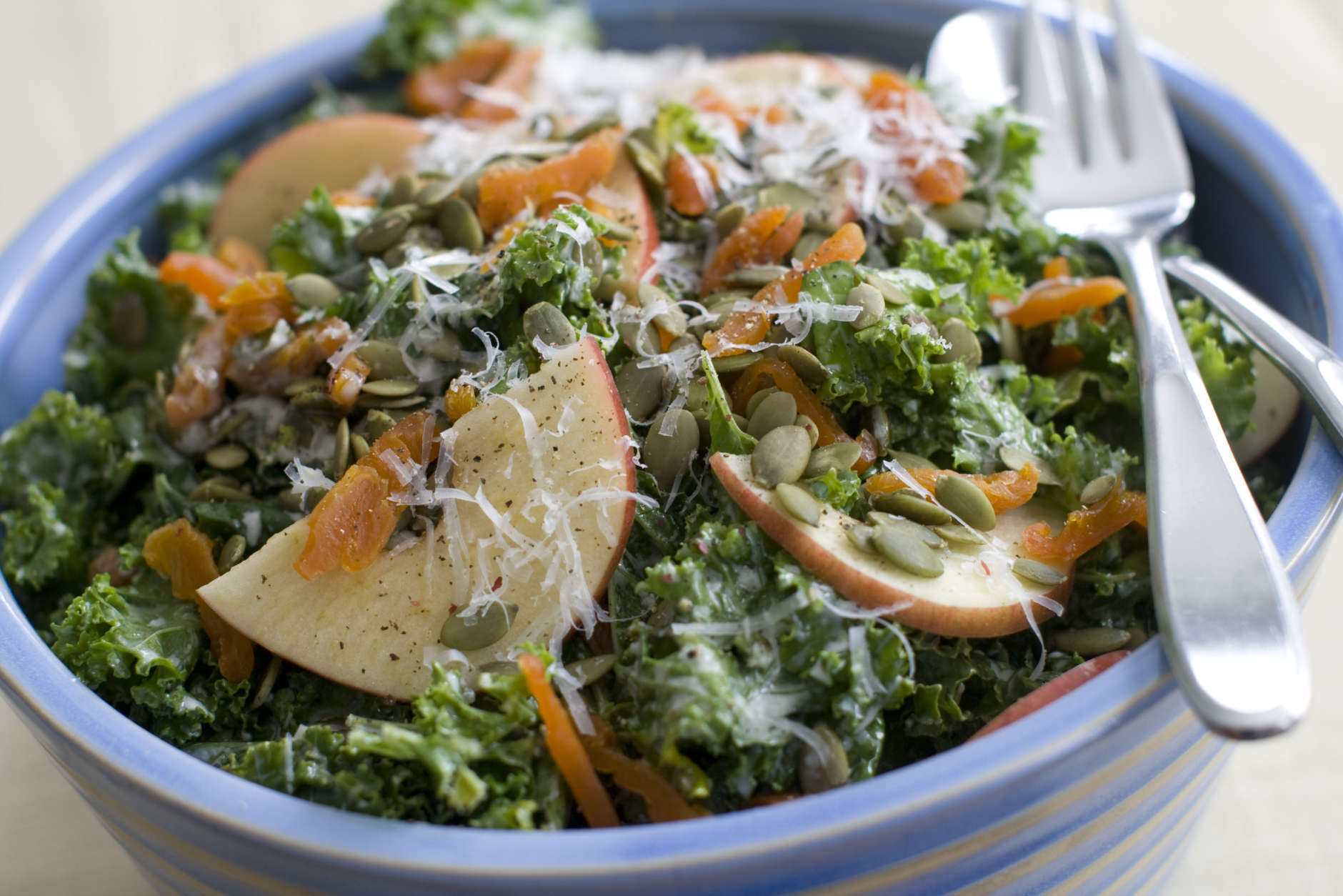 This March 10, 2014 photo shows kale salad with apples apricots and manchego cheese in Concord, N.H. (AP Photo/Matthew Mead)