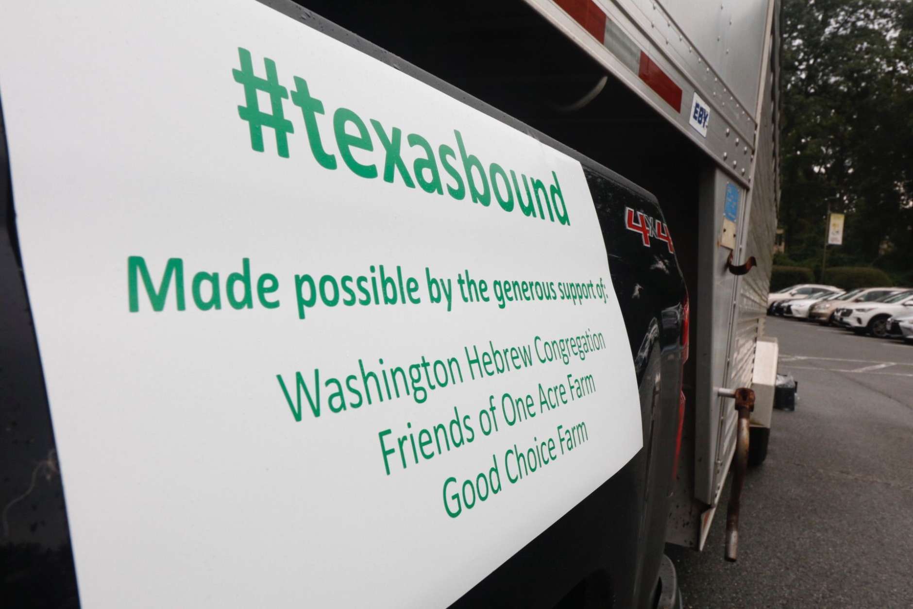 Catherine Doyle of Doyle Signs made the magnetic signs stuck to the side of the Texas-bound truck. (WTOP/Kate Ryan)