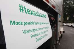 Catherine Doyle of Doyle Signs made the magnetic signs stuck to the side of the Texas-bound truck. (WTOP/Kate Ryan)
