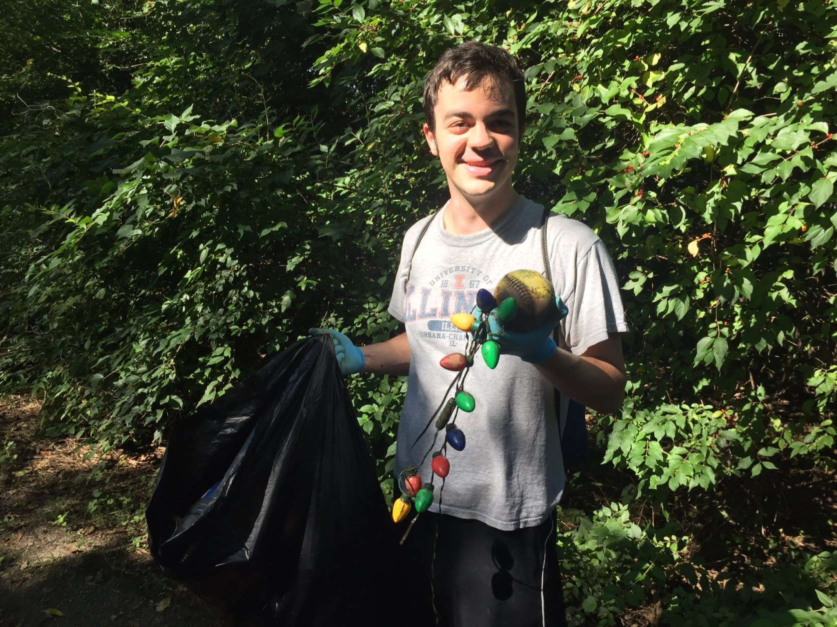 Paul Christianson of Tenleytown shows off his nomination for oddest trash found during Anacostia cleanup Sept. 16, 2017. (WTOP/John Domen)
