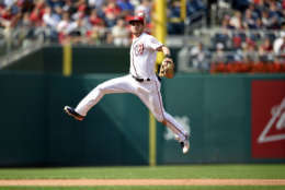Washington Nationals shortstop Trea Turner leaps up to throw to first to get out Philadelphia Phillies Freddy Galvis during the seventh inning of a baseball game, Sunday, Sept. 10, 2017, in Washington. The Nationals won 3-2. (AP Photo/Nick Wass)