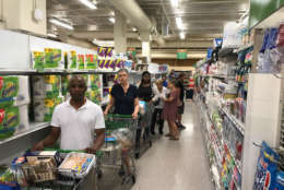 Residents of South Beach, Florida, prepare for Hurricane Irma's arrival at Publix Supermarket Thursday, Sept. 7. (WTOP/Steve Dresner)