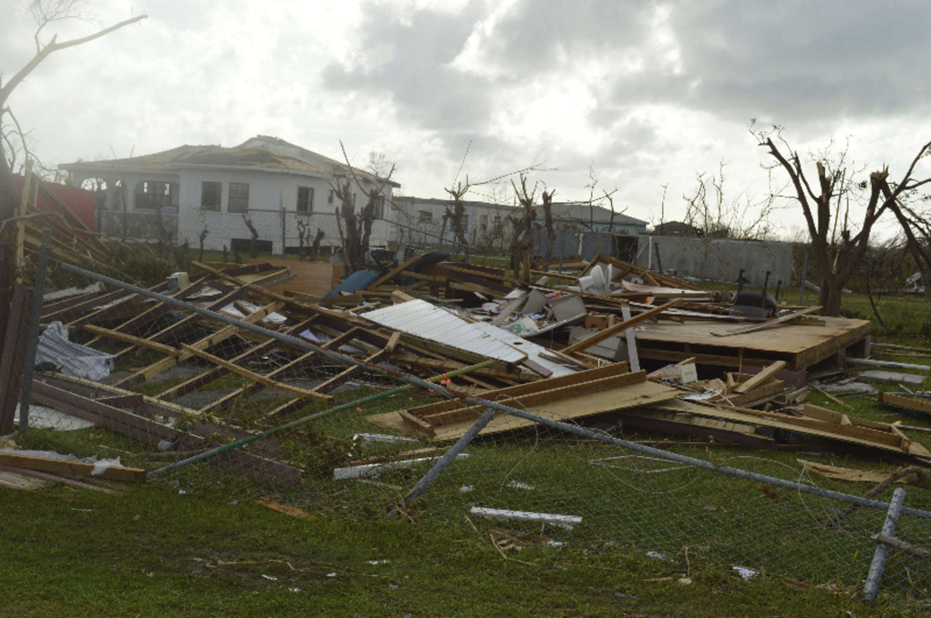 In this Thursday, Sept. 7, 2017, photo, damage is left after Hurricane Irma hit Barbuda. Hurricane Irma battered the Turks and Caicos Islands early Friday as the fearsome Category 5 storm continued a rampage through the Caribbean that has killed a number of people, with Florida in its sights. (AP Photo/Anika E. Kentish)