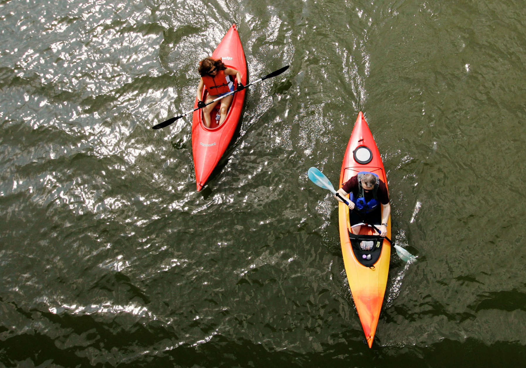 Heather McAusland, left, and Eric Papula of Virginia kayak along the Potomac River near the Theodore Roosevelt Island, Saturday, June 9, 2007, in Washington. (AP Photo/Haraz N. Ghanbari)
